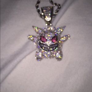 white gold pokémon pendant